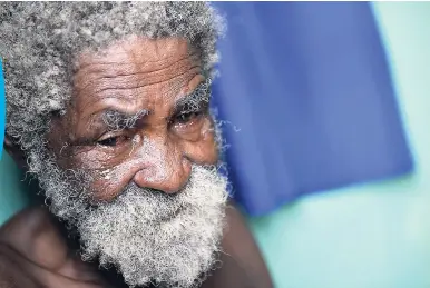  ?? RICARDO MAKYN/MULTIMEDIA PHOTO EDITOR ?? A teary-eyed 68-year-old Cleston Williams is wearing just his pants after losing everything in a fire at 68 Bond Street in Denham Town, Kingston, yesterday. The blaze, which started at approximat­ely 8 a.m., left 17 homeless: 10 adults and seven...