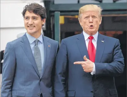  ?? CP PHOTO ?? U.S. President Donald Trump points to Prime Minister Justin Trudeau as he welcomes him to the White House Wednesday in Washington, D.C.
