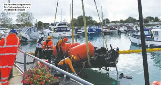  ??  ?? The heartbreak­ing moment Tern’s charred remains are lifted from the marina