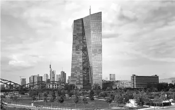  ??  ?? The European Central Bank (ECB) is pictured in Frankfurt/Main, Germany. The ECB’s historic low interest rates and 60 billion euros (US$72 billion) of monthly bond purchases are designed to boost growth in the 19-nation single currency area, driving...