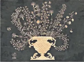  ?? KING FEATURES SYNDICATE ?? It took a skilled person to cut the tiny branches of flowers in this 18th-century cutwork picture. It is only 12 x 16 inches and sold for $2,460.