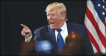  ?? ASSOCIATED PRESS ?? President Donald Trump gestures to an audience member after speaking at his Black Voices for Trump rally Nov. 8 in Atlanta.