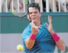  ?? FRANCOIS-XAVIER MARIT/THE ASSOCIATED PRESS ?? Canada’s Milos Raonic returns the ball to Belgium’s Steve Darcis during their tennis match at the Roland Garros 2017 French Open on Monday, in Paris.