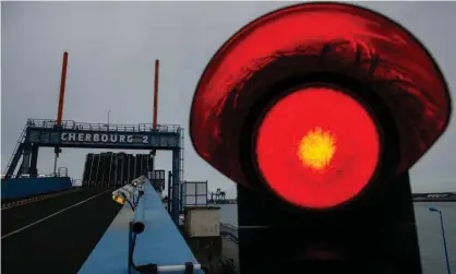  ?? Photograph: Gonzalo Fuentes/Reuters ?? A red light to traffic pictured at Cherbourg in France.