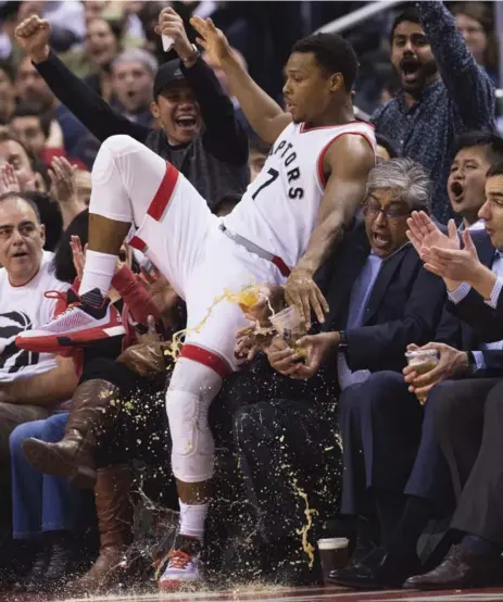  ?? NATHAN DENETTE/THE CANADIAN PRESS ?? Raptors guard Kyle Lowry was in the Spurs’ faces and the fans’ laps on Wednesday night, with 19 points and at least one spilled drink.