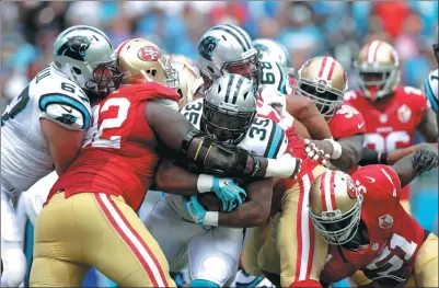  ?? STREETER LECKA / GETTY IMAGES / AFP ?? Mike Tolbert (35) of the Carolina Panthers runs with the ball against the San Francisco 49ers during their game at Bank of America Stadium on Sept 18 in Charlotte, North Carolina. The Panthers defeated the 49ers 46-27.