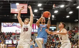  ?? DAVID JABLONSKI / STAFF ?? Toumani Camara scored 17 points, missing just two shots, in Dayton’s 65-49 win at Loyola Chicago on Friday. The Flyers have won five of six.