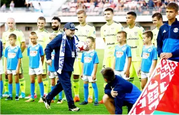  ??  ?? Diego Maradona,Argentina’s soccer legend and newly appointed chairman of the board of Dynamo Brest football club, arrives at the stadium to watch the match between Dinamo-Brest and Shakhtyor Soligorsk in Brest, Belarus iin this July 16 file photo. — Reuters photo