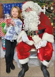  ?? PHOTO COURTESY OF CONNIE ROUB ?? Santa stopped by the Little Shops of Shelby on Saturday afternoon.
