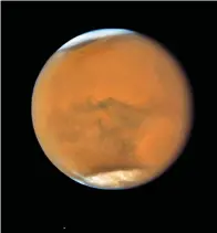  ?? Associated Press ?? ■ Mars as seen by NASA’s Hubble Space Telescope on July 18, near its closest approach to Earth since 2003.