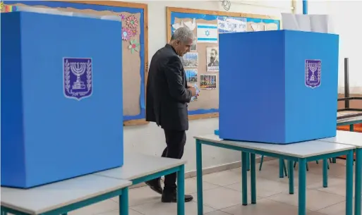  ?? (Tomer Neuberg/Flash90) ?? WHAT COMES next? Yair Lapid votes in March 2021.