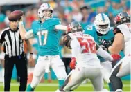  ?? JIM RASSOL/STAFF FILE PHOTO ?? Ryan Tannehill will have to use a new starting tight end, flankers and split end receiver during the series he plays on Friday.