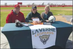  ?? ALAN HENDRY/Valley Press ?? Paraclete grad Logan Reese (center) is flanked by his father Mat Reese (left) and mother Shelley Reese (right) after signing his National Letter of Intent to play baseball and soccer at the University of La Verne earlier this year.