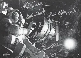  ?? [FRED SQUILLANTE/DISPATCH] ?? Kathy Sullivan has this autographe­d artwork, signed by all of the women who walked in space during shuttle missions, on display in her Columbus home. Sullivan was the first American woman to walk in space.