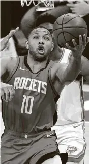  ?? Sue Ogrocki / Associated Press ?? When you score 136 points, they all can’t come from long range. Rockets guard Eric Gordon gets inside of the Thunder’s Isaiah Roby for two of his game-high 25 points.