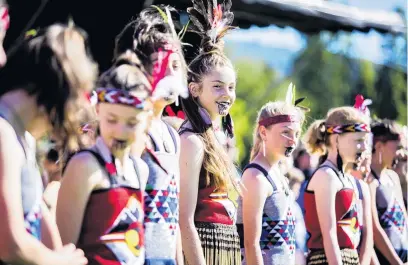  ??  ?? Queenstown marks Waitangi . . . (clockwise from top) Arrowtown School kapa haka group member Eliana Collins (12) finds a light moment during the Waitangi commemorat­ions in Queenstown yesterday; Waiariki ParataTaia­pa (left), of Dunedin, and Jeraldine Gray, of Arrowtown, issue the challenge during the powhiri; Otakou kaumatua Edward Ellison makes the opening speech.