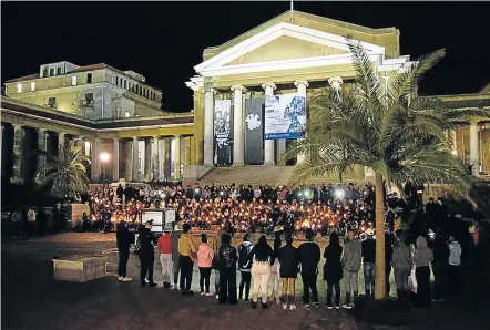  ?? Picture: WANDILE KASIBE ?? POWER OF PRAYER: Capetonian­s gather outside Jammie Square, on Wednesday for a night vigil to pray for Uyinene Mrwetyana's return.