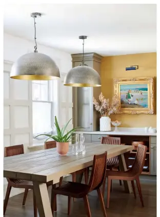 ?? FOR SOURCES, SEE OUR WORKBOOK ?? Yellow WALLPAPER, Vinyl Abstract Solid 6484 in Mustard, Phillip Jeffries. Gilt-framed PAINTING, Of Things Past. LIBRARY LIGHT, Robinson Lighting & Bath. DINING TABLE, RH. PENDANTS, CB2.