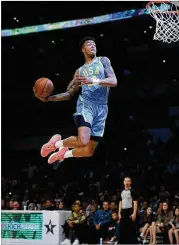  ?? KEVORK DJANSEZIAN / GETTY IMAGES ?? John Collins scored 11 points for TeamUSA, including someseriou­s dunks, during the Rising StarsGameo­n Saturday in L.A.