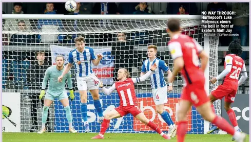  ?? PICTURE: PSI/Stan Kasala ?? NO WAY THROUGH: Hartlepool’s Luke Molyneux clears the ball in front of Exeter’s Matt Jay