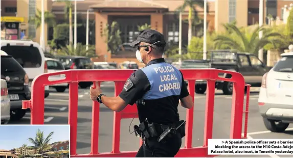  ??  ?? > A Spanish police officer sets a barrier blocking the access to the H10 Costa Adeje Palace hotel, also inset, in Tenerife yesterday