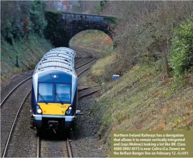  ?? ALAMY. ?? Northern Ireland Railways has a derogation that allows it to remain vertically integrated and (says Wolmar) looking a lot like BR. Class 4000 DMU 4015 is near Cultra (Co. Down) on the Belfast-Bangor line on February 12.