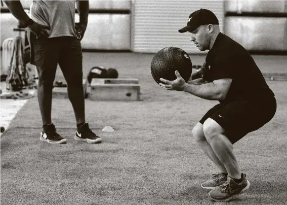  ?? Photos by Yi-Chin Lee / Staff photograph­er ?? Plex owner Danny Arnold has been training pro athletes for 17 years. He keeps his workout groups small and cleans his facility regularly in the age of COVID-19.