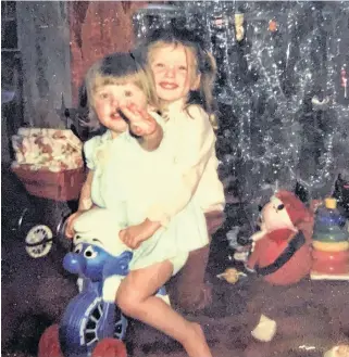  ??  ?? Leigh-ann Payne celebrates her birthday Dec. 25. She is shown here as a child with her younger sister, Jacqueline.