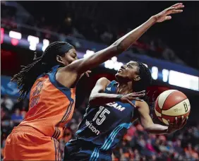  ?? SEAN D. ELLIOT/THE DAY ?? Connecticu­t’s Jonquel Jones defends against Atlanta’s Tiffany Hayes during a game on May 13 at Mohegan Sun Arena. It’s been a breakthrou­gh season for the second-year center, who gave the nation a glimpse of her talents at the WNBA All-Star Game.