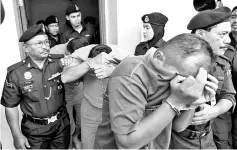  ??  ?? The three Navy personnel were charged in connection with the death and assault of two colleagues at the Sungai Wangi detention unit , Sitiawan, last Sept 29. - Bernama photo