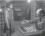  ?? PHIL BRAY/ NETFLIX ?? Young Beth ( Isla Johnston) learns chess from Mr. Shaibel ( Bill Camp ) in the Netflix miniseries “The Queen’s Gambit.”