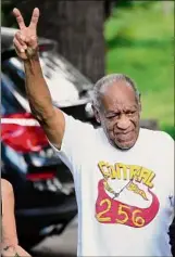  ?? Matt Slocum / Associated Press ?? Bill Cosby approaches media members gathered outside his Elkins Park, Pa. home Wednesday. The state's highest court overturned his sexual assault conviction.