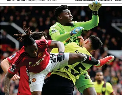  ?? GETTY IMAGES ?? Rush of blood: keeper Onana crashes into Amdouni to concede the late penalty