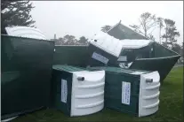  ?? RYAN SUN — THE ASSOCIATED PRESS ?? Fallen portable toilets are shown at Pebble Beach Golf Links before the scheduled final round of the AT&T Pebble Beach National Pro-Am golf tournament in Pebble Beach, Calif., on Sunday. The final round of the AT&T Pebble Beach Pro-Am was canceled Sunday night due to prolonged bad
