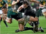  ??  ?? All Blacks flanker Liam Squire, here launching into a tackle on Springboks midfielder Jesse Kriel last month, is vying for the No 6 jersey worn with such distinctio­n by Jerome Kaino, left.