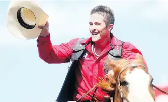  ?? DARREN MAKOWICHUK ?? Zane Lambert of Ponoka acknowledg­es of the cheers of the crowd after winning Wednesday’s bull riding event at the Calgary Stampede with an 88-point ride. He sits third in the aggregate standings.