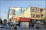  ??  ?? VISUAL REMINDER: A large mural near the former US Embassy in Iran’s capital, Tehran, depicts a soldier during the period of the war with Iraq that followed the Islamic revolution in 1979.