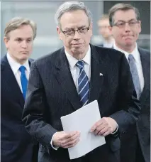  ?? C A NA D I A N P R E S S F I L E S ?? Finance Minister Joe Oliver, centre, has his work cut out for him in the next federal budget with a slide in oil revenue .