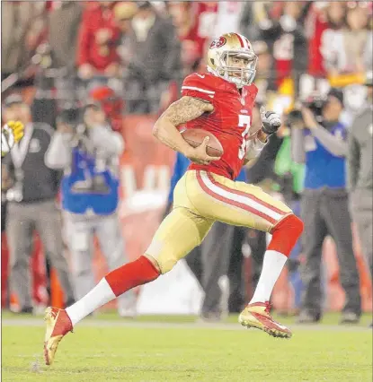  ??  ?? Quarterbac­k Colin Kaepernick of the 49ers had a record-setting game against the Packers last week.
| TONY AVELAR~AP