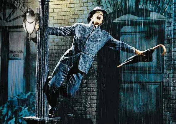  ?? Divulgação ?? Gene Kelly em cena de ‘Cantando na Chuva’ (1952)