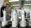  ?? ARIEL JEROZOLIMS­KI/ BLOOMBERG FILES ?? An employee packages carbon dioxide cylinders at a SodaStream factory in Mishor Adumim, near Jerusalem.