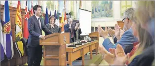  ?? CP PHOTO ?? Prime Minister Justin Trudeau receives a standing ovation at the National Caucus meeting on Parliament Hill in Ottawa on Friday.