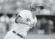  ?? [PHOTO BY BRYAN TERRY, THE OKLAHOMAN] ?? Oklahoma City’s Corey Seager rounds first base after hitting a double in 2015.