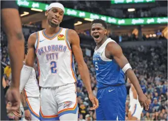  ?? AP PHOTO/ABBIE PARR ?? The Minnesota Timberwolv­es’ Anthony Edwards, right, celebrates next to Oklahoma City Thunder guard Shai Gilgeous-Alexander after making a basket while getting fouled during a Jan. 20 game in Minneapoli­s.