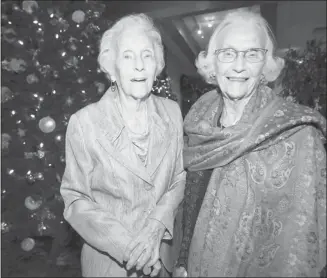  ?? Stuart Gradon/calgary Herald ?? Twin sisters Marion Pennington, left, and Myrtle Black celebrate their 90th birthdays on Tuesday at the Calgary Golf and Country Club with a big family gathering.