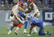  ?? RICK OSENTOSKI — THE ASSOCIATED PRESS ?? Browns tight end Seth DeValve fumbles near Lions cornerback Nevin Lawson (24), who recovered the ball and returned it for a 44-yard touchdown during the first half Nov. 12 in Detroit.