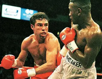  ??  ?? DEFENSIVE GENIUS: Oscar De La Hoya [above] and Andrey Pestryaev [below, left] have a hard time trying to pin down Whitaker, who goes on the attack against Chavez [below]
