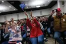  ?? Christian Monterrosa/AFP/Getty Images ?? Attendees cheer for US Representa­tive Marjorie Taylor Greene (R-GA) as she speaks during a ‘commit to caucus’ Trump Iowa event at the Hidden Tower wedding venue in Keokuk, Iowa on 4 January. Photograph: