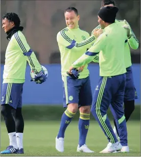  ?? Picture PAUL GILHAM, GALLO IMAGES ?? PLENTY OF REASONS TO SMILE: Chelsea captain John Terry jokes with Didier Drogba during training in Cobham yesterday.