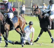  ?? Picture: ESA ALEXANDER ?? DOING IT FOR THE KIDS: Prince Harry gets up after his fall during the Sentebale Royal Salute Polo Cup match at Val de Vie Estate in Paarl, Cape Town, yesterday